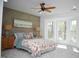 Bright bedroom featuring a unique accent wall, neutral decor, and a ceiling fan for added comfort at 5013 Brassfield Dr, Rocky Mount, NC 27803