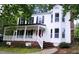 Charming two-story home with a welcoming front porch and beautifully maintained landscaping at 5013 Brassfield Dr, Rocky Mount, NC 27803