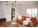 Cozy living room featuring stylish decor, hardwood floors, and natural light, perfect for relaxation and entertaining at 5013 Brassfield Dr, Rocky Mount, NC 27803