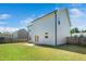 Large backyard with a well-maintained lawn, privacy fence, and patio at 51 Duchess Ave, Franklinton, NC 27525