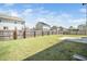 Large, fenced backyard featuring a well-kept lawn and a concrete patio at 51 Duchess Ave, Franklinton, NC 27525