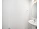 A half bathroom has white walls and a pedestal sink at 51 Duchess Ave, Franklinton, NC 27525