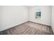 A bedroom featuring carpet floors and a window that provides plenty of natural light at 51 Duchess Ave, Franklinton, NC 27525