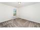 Carpeted bedroom with a window providing natural light at 51 Duchess Ave, Franklinton, NC 27525