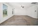 A spacious empty bedroom featuring neutral carpet, white walls, two windows, and a ceiling fan at 51 Duchess Ave, Franklinton, NC 27525