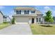 Charming two-story home featuring a spacious two car garage and a well-manicured front lawn at 51 Duchess Ave, Franklinton, NC 27525
