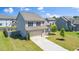 Attractive two-story home with a two-car garage and neatly landscaped front yard at 51 Duchess Ave, Franklinton, NC 27525