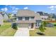 Charming two-story home with a two-car garage, well-manicured lawn, and attractive landscaping at 51 Duchess Ave, Franklinton, NC 27525