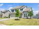 Two-story home with a two car garage, front lawn and fresh landscaping at 51 Duchess Ave, Franklinton, NC 27525