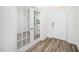 Bright foyer features hardwood floors, white walls, glass paneled doors, and a white front door at 51 Duchess Ave, Franklinton, NC 27525