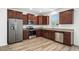 New kitchen with stainless steel appliances and wooden cabinets at 51 Duchess Ave, Franklinton, NC 27525