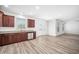 Spacious kitchen featuring stainless steel appliances, wood cabinets, and laminate flooring at 51 Duchess Ave, Franklinton, NC 27525