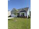 Charming single-story home with a two-car garage, manicured lawn, and inviting front porch at 529 Winding Creek Drive Dr, Lillington, NC 27546