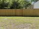 Expansive backyard featuring a well-maintained lawn and a new wooden fence providing security and privacy at 541 N Daughtry St, Rocky Mount, NC 27801