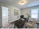 Comfortable office space with a desk, computer, and a relaxing view from the window at 58 Butterbean Ct, Zebulon, NC 27597