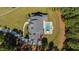 Aerial view captures the home's layout with a private pool and spa in a beautifully landscaped backyard at 6 Castlewood Dr, Durham, NC 27713