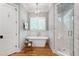 Well-appointed bathroom with soaking tub, glass-enclosed shower, and stylish fixtures at 6 Castlewood Dr, Durham, NC 27713