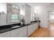 Elegant bathroom features double vanities, granite countertops, and large mirrors at 6 Castlewood Dr, Durham, NC 27713