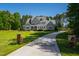 Charming gray home with a lush lawn and long private driveway at 6 Castlewood Dr, Durham, NC 27713
