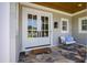 Welcoming front entrance with double doors and a cozy seating area at 6 Castlewood Dr, Durham, NC 27713