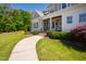 Inviting front porch with seating area and stone walkway at 6 Castlewood Dr, Durham, NC 27713