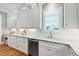 Kitchen boasting modern appliances, shaker cabinets, subway tile backsplash, and marble countertops at 6 Castlewood Dr, Durham, NC 27713