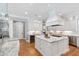 Gourmet kitchen with marble countertops, stainless steel appliances, and a center island with seating at 6 Castlewood Dr, Durham, NC 27713
