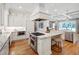 Chef's kitchen features a marble island, stainless appliances, and custom cabinets at 6 Castlewood Dr, Durham, NC 27713