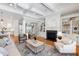 Cozy living room with fireplace, built-in shelves, and an open layout with seamless flow to the kitchen at 6 Castlewood Dr, Durham, NC 27713