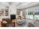 Bright living room with fireplace, built-ins, and access to the backyard at 6 Castlewood Dr, Durham, NC 27713