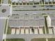 An aerial view showcases stylish townhomes with decks, surrounded by well-maintained landscaping at 608 Grand Central Sta, Apex, NC 27502