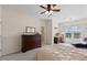 Spacious bedroom featuring a large dresser, ceiling fan, and cozy seating area at 608 Grand Central Sta, Apex, NC 27502