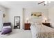 Inviting bedroom with a plush bed, accent chair, and stylish furnishings at 608 Grand Central Sta, Apex, NC 27502
