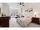 Bright bedroom featuring a ceiling fan, comfortable seating, and ample natural light at 608 Grand Central Sta, Apex, NC 27502