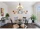 Well-lit dining area featuring chandelier lighting and natural sunlight at 608 Grand Central Sta, Apex, NC 27502
