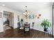 Inviting dining area with hardwood floors and glass table at 608 Grand Central Sta, Apex, NC 27502