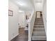 Inviting entryway with hardwood floors and staircase leading to the upper level at 608 Grand Central Sta, Apex, NC 27502