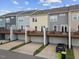 Modern townhome exteriors feature charming decks and convenient garage parking at 608 Grand Central Sta, Apex, NC 27502