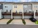 Beautiful townhome exteriors with decks provide modern living and convenient parking at 608 Grand Central Sta, Apex, NC 27502