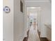 Hallway with hardwood floors leading to dining area and bright interior spaces at 608 Grand Central Sta, Apex, NC 27502