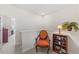 Hallway sitting area with chair, bookshelf, and views to the living areas at 608 Grand Central Sta, Apex, NC 27502