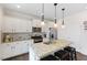Charming kitchen featuring granite counters, stainless appliances, and a center island with seating at 608 Grand Central Sta, Apex, NC 27502