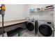 The laundry room has modern appliances, extra counter space, and ample storage at 608 Grand Central Sta, Apex, NC 27502