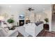 Well-lit living room with fireplace, comfortable seating, and stylish decor at 608 Grand Central Sta, Apex, NC 27502
