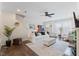 Bright living room features fireplace, ceiling fan and neutral decor at 608 Grand Central Sta, Apex, NC 27502