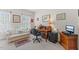 Bright office area with sofa, desk, chair, and natural light through the windows at 608 Grand Central Sta, Apex, NC 27502