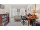 Bright office with sofa, desk, chair, and large windows with sheer curtains at 608 Grand Central Sta, Apex, NC 27502