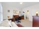 Cozy office with desk, chair, sofa, and views into attached bathroom at 608 Grand Central Sta, Apex, NC 27502