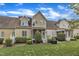 A full view of the back exterior with backyard, lawn, patio and neat landscaping at 625 Canvas Dr, Wake Forest, NC 27587