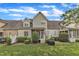 Lawn with backyard view of home’s exterior, showing landscaping, lawn, patio and screened porch at 625 Canvas Dr, Wake Forest, NC 27587